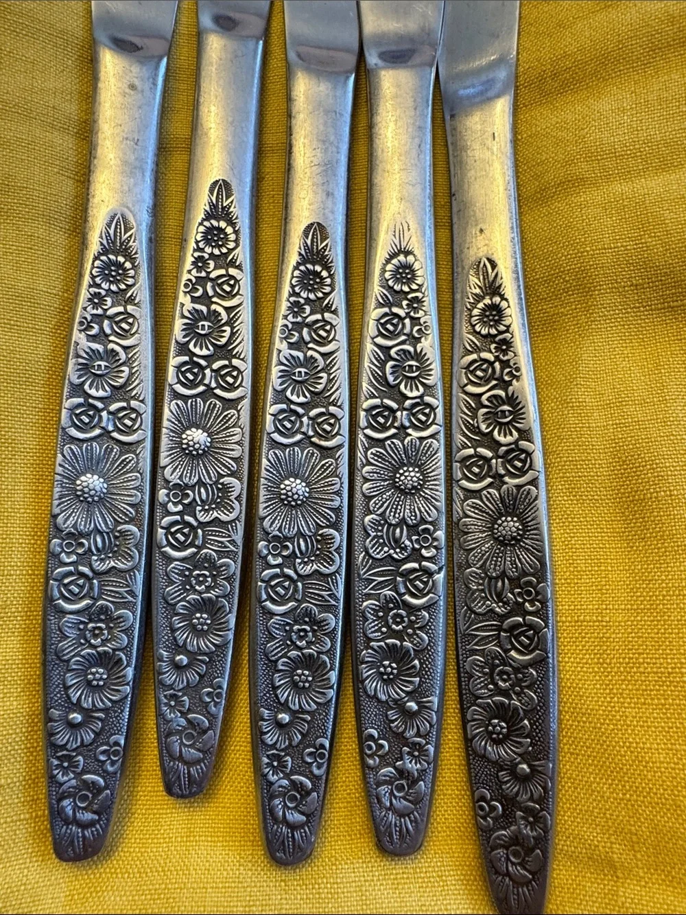 5 floral handled butter knives